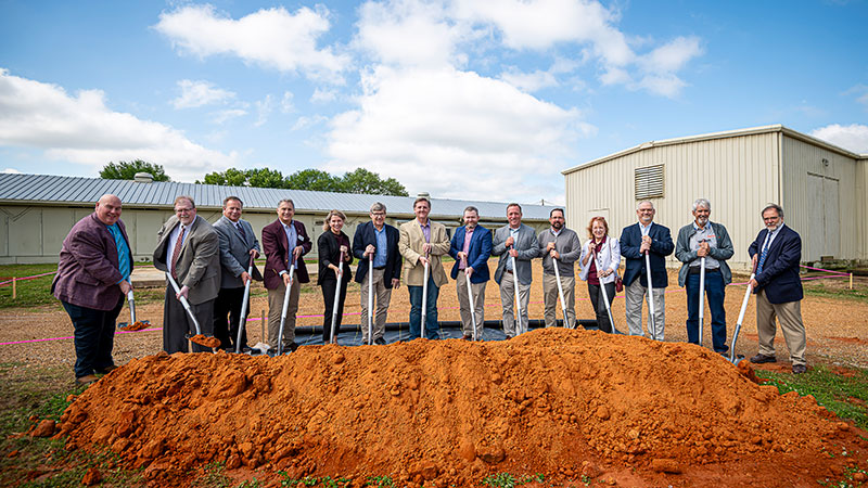 MSU administrators and poultry supporters use shovels to break ground on the new poultry feed mill